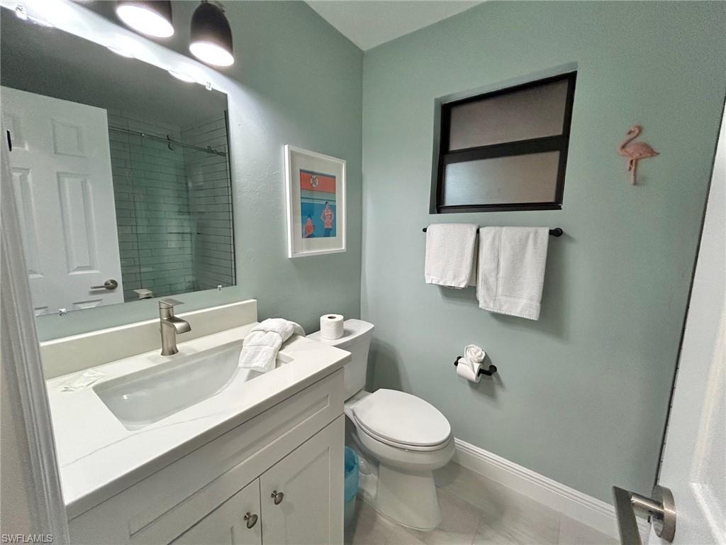 Bathroom with vanity and a shower