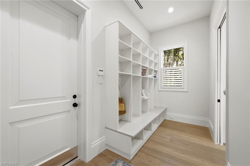 Mudroom with light wood-type flooring and recessed lighting