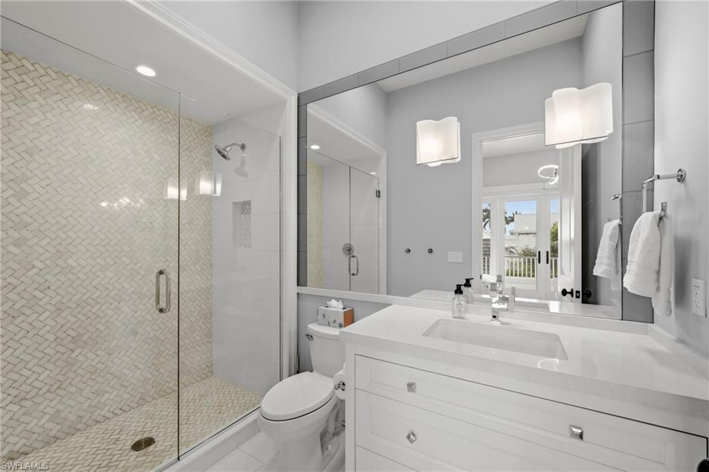 Bathroom featuring vanity, a shower stall, and recessed lighting