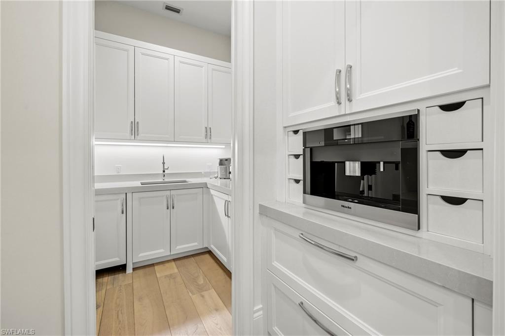 Kitchen featuring expresso coffee maker.