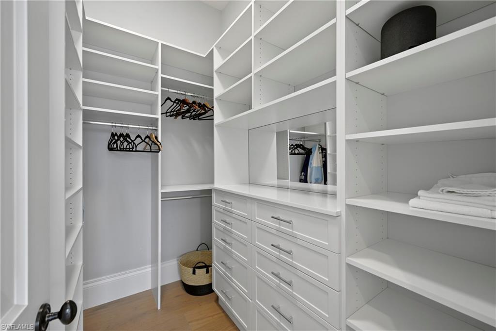 Walk in closet featuring light wood finished floors