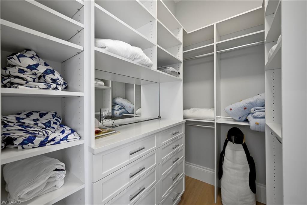Walk in closet featuring light wood-type flooring