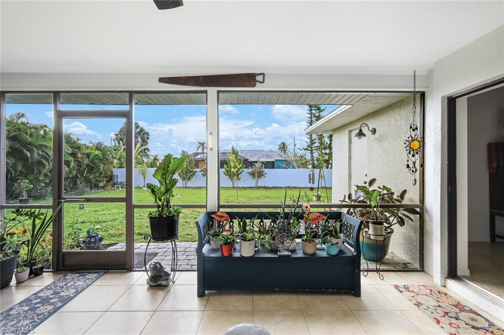 Sunroom with tile patterned flooring