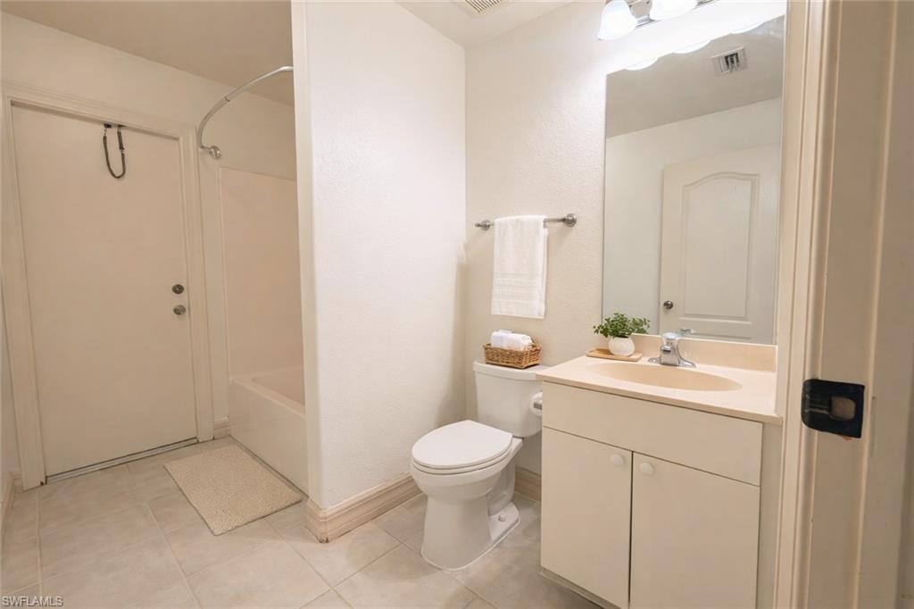 Virtual staged Full bathroom featuring vanity and shower / tub combination