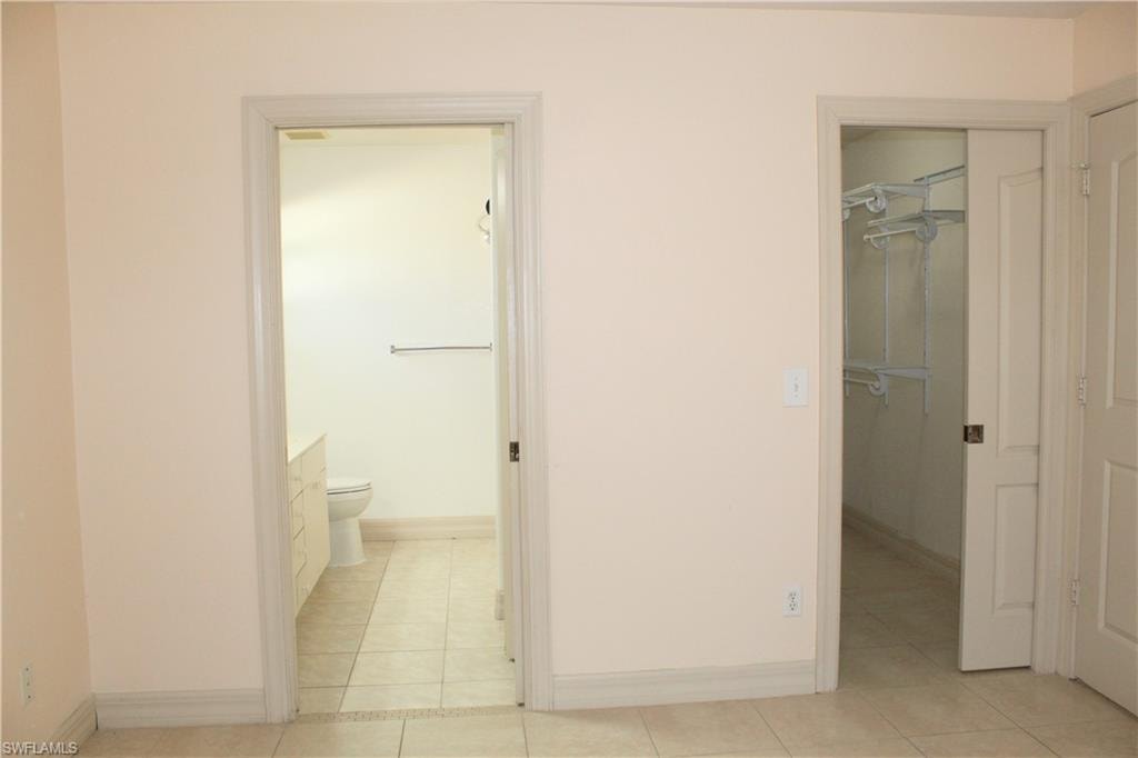 Bathroom featuring light tile patterned floors and vanity