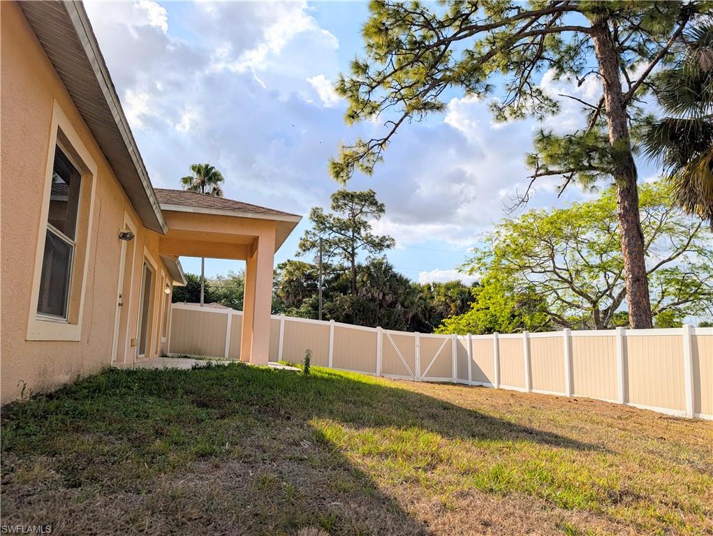 View of fenced backyard