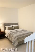 Bedroom featuring light tile patterned floors