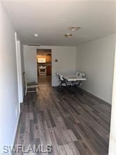 Dining space featuring dark wood-style floors