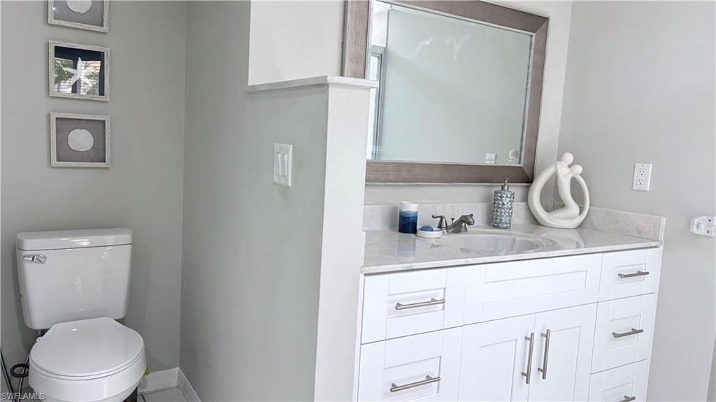 Bathroom featuring vanity and toilet