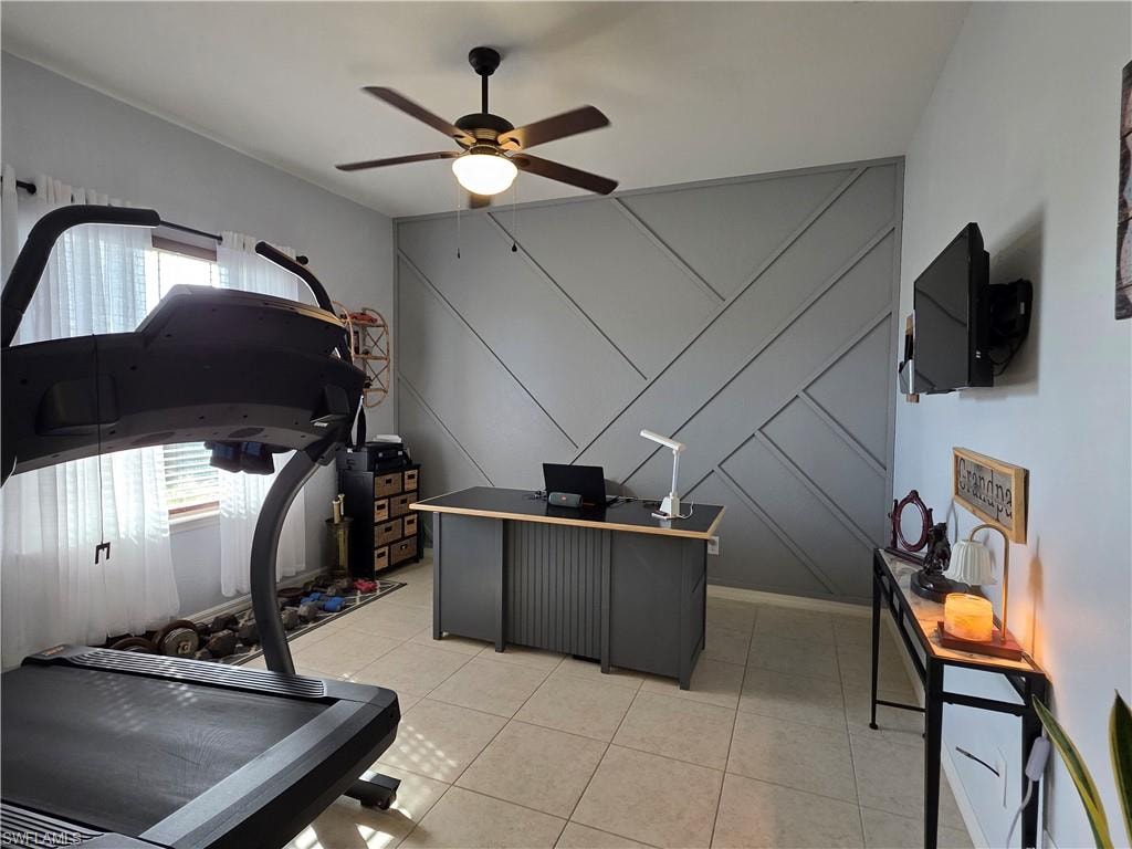 Office/ Den with ceiling fan and Decorative Wall
