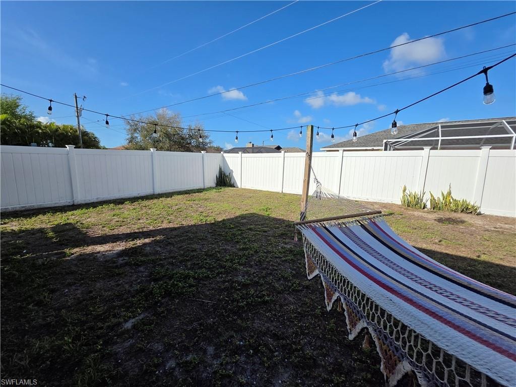View of fenced backyard