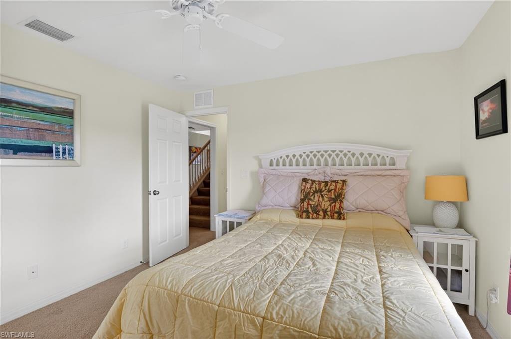 Bedroom featuring carpet and ceiling fan