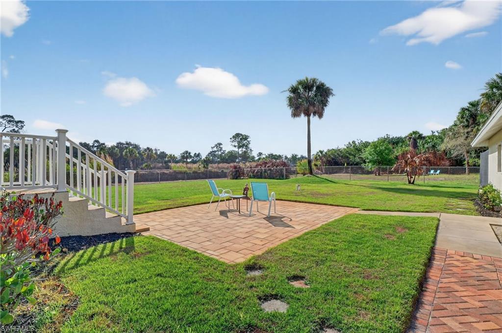 Fenced yard featuring a patio