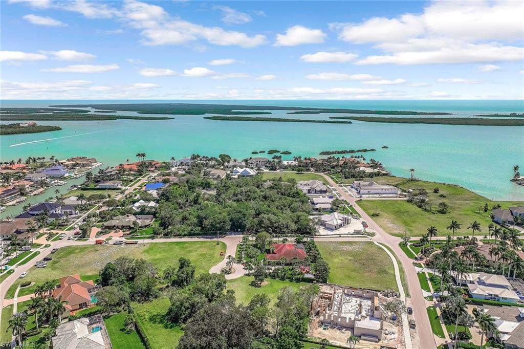 Aerial view of residential area featuring a large body of water
