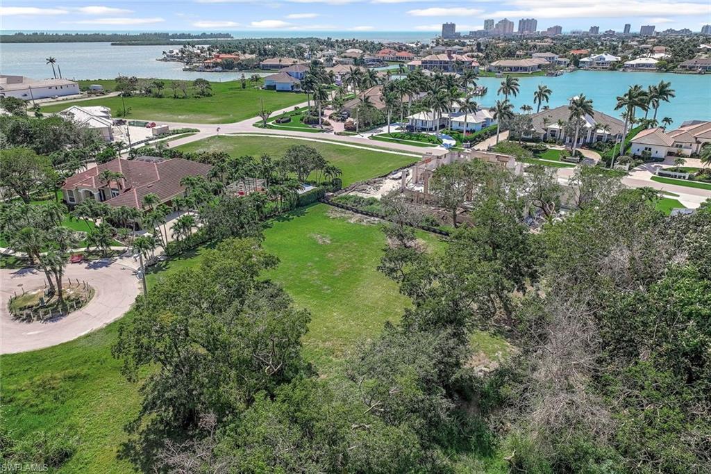 Aerial view of residential area featuring a large body of water