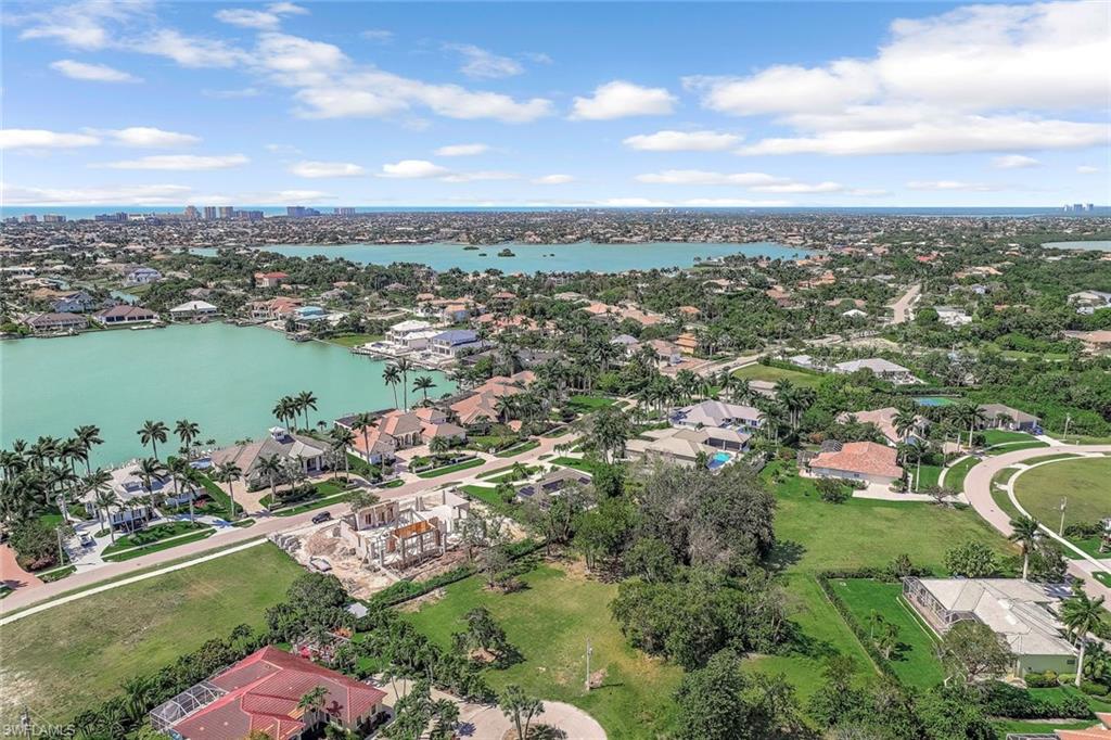 Aerial view of residential area with a large body of water