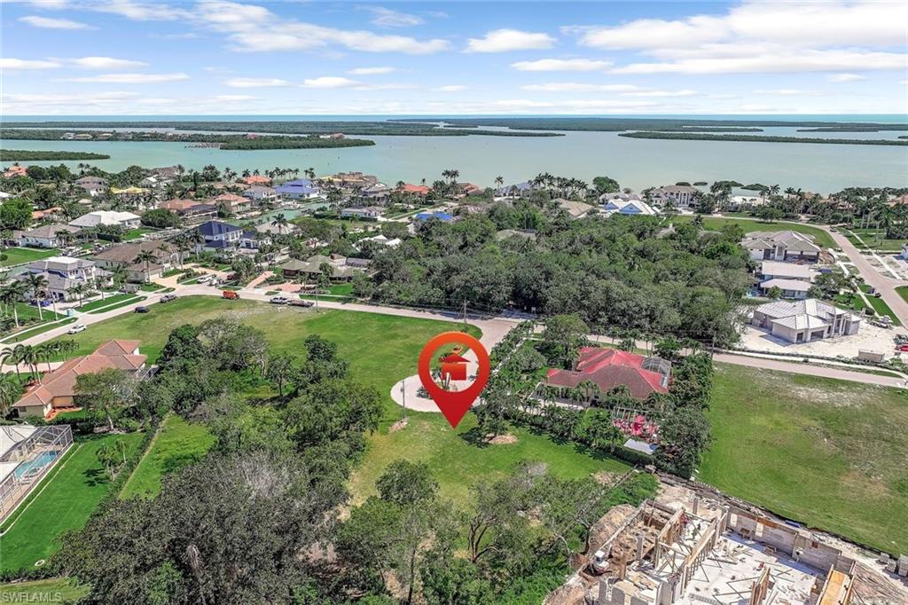 Aerial perspective of suburban area with a nearby body of water