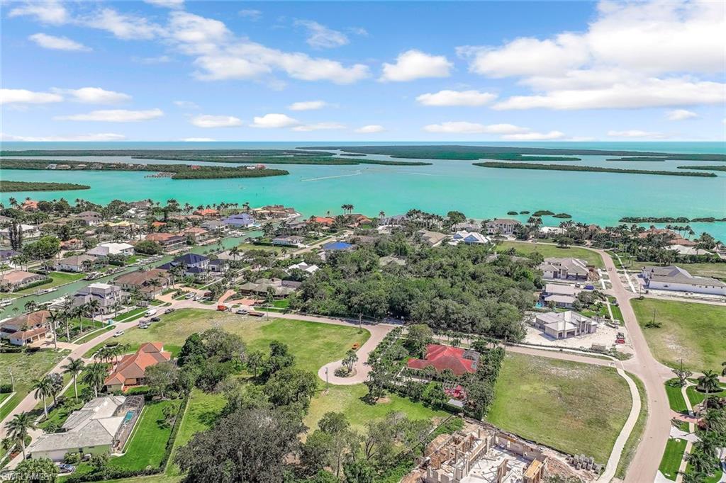Aerial view of residential area with a nearby body of water