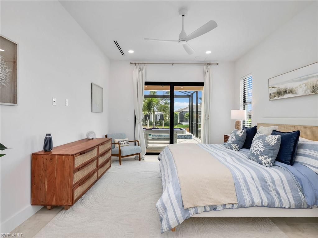 Bedroom with ceiling fan, access to exterior, and recessed lighting