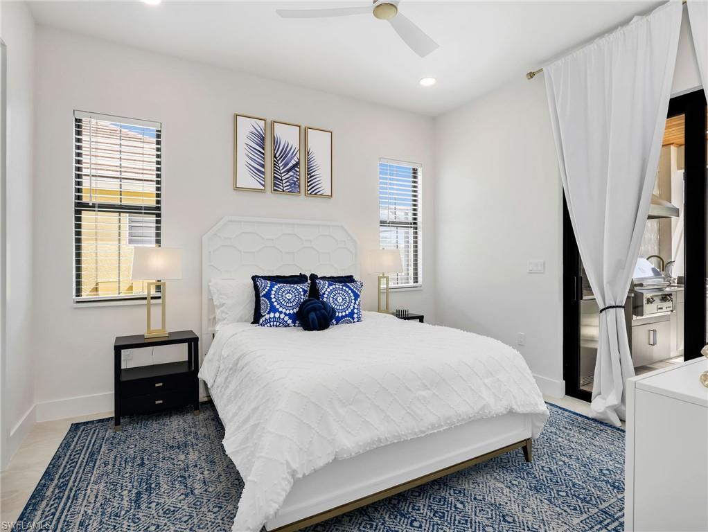 Bedroom featuring multiple windows, recessed lighting, and a ceiling fan