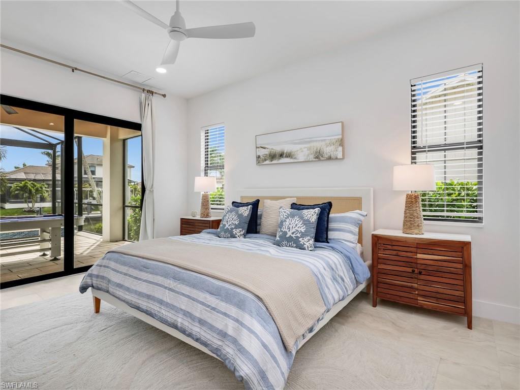 Bedroom featuring access to outside, a ceiling fan, and recessed lighting