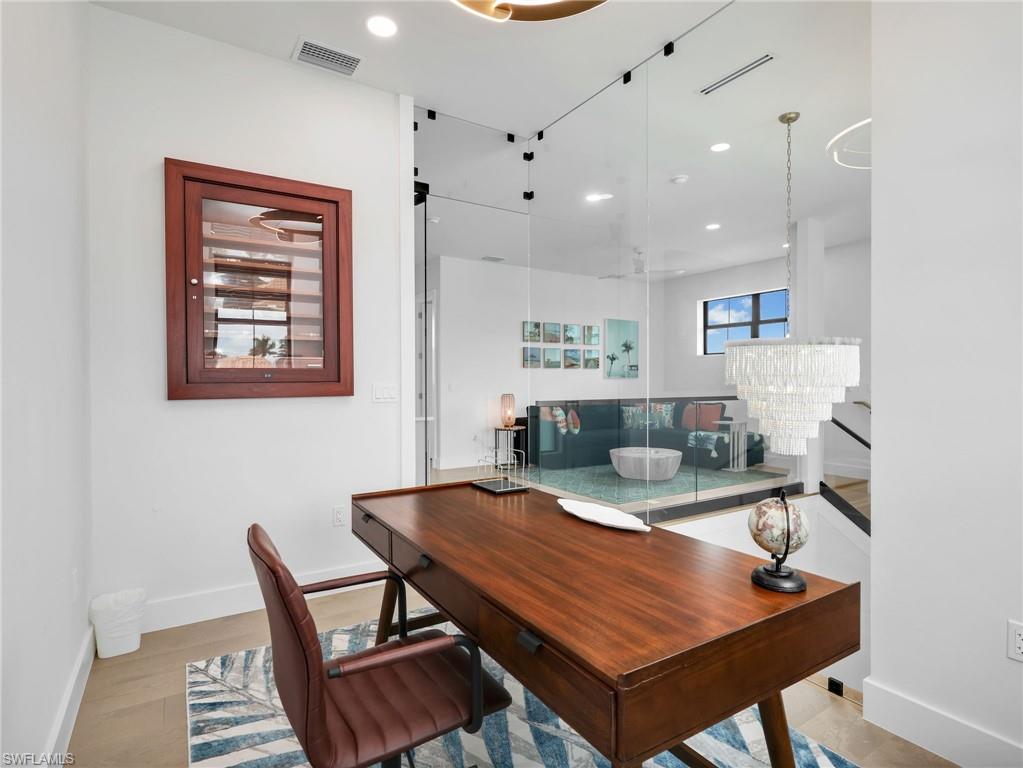 Office area featuring recessed lighting and light wood-style flooring