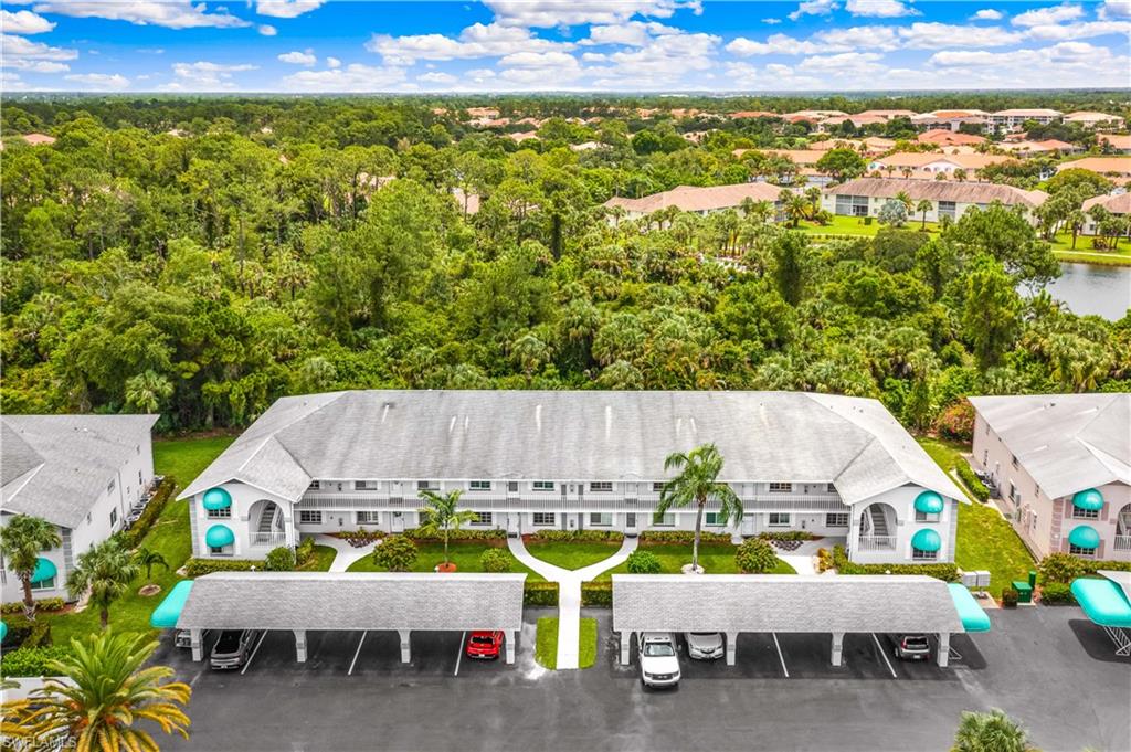 Front of unit building and carport - one designated parking spot