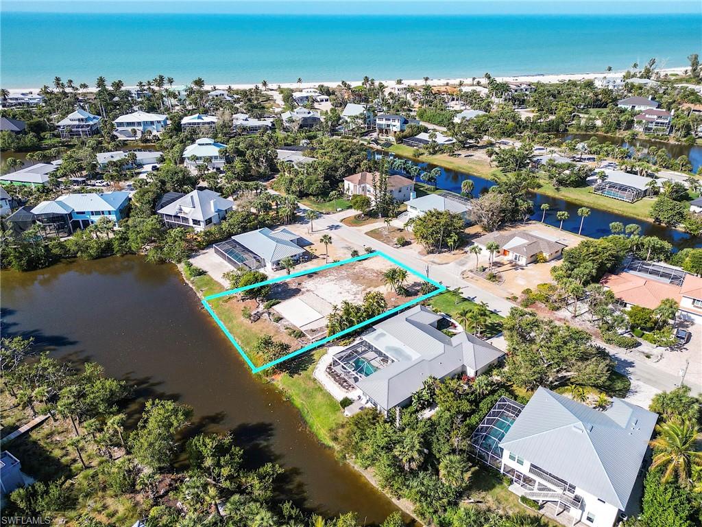 Aerial view of lot. Steps to the Gulf water.