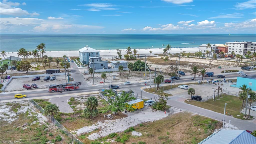 Aerial view of waterfront with a beach
