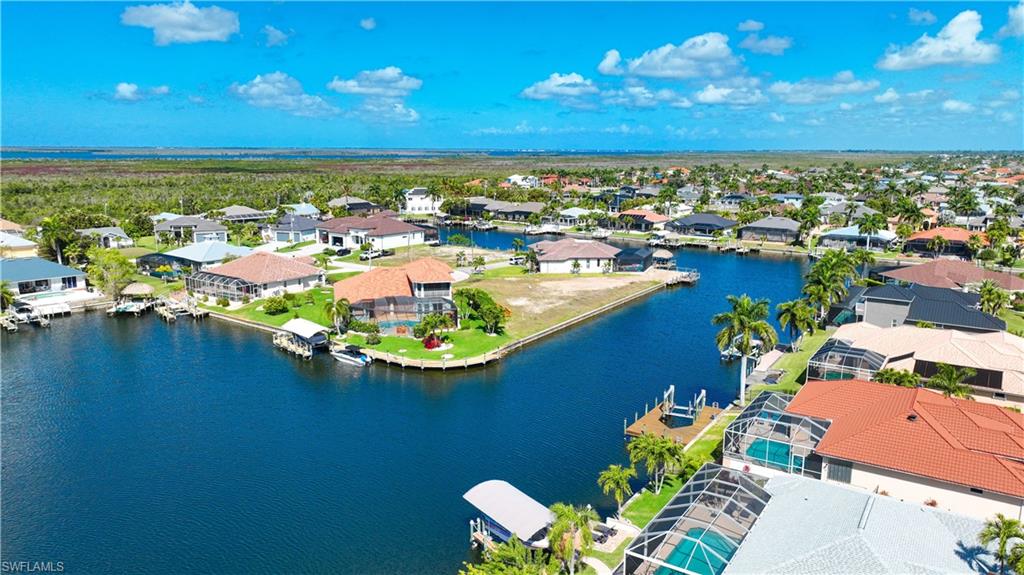 Aerial perspective of suburban area with a large body of water