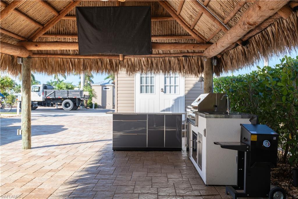 View of patio / terrace featuring exterior kitchen