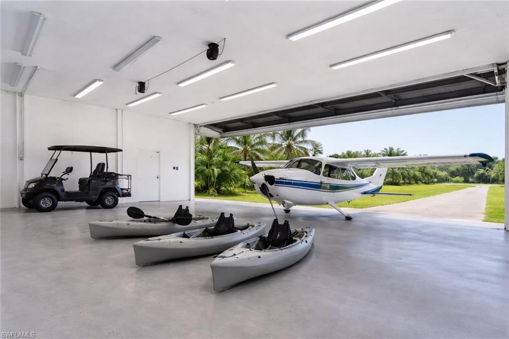 The 29'5" x 36'7" hangar-style garage offers substantial space for vehicles, gear, and island toys and may appeal to owners of certain light aircraft, but exact aircraft fit depends on the clear door opening, interior height, tail height, and wing configuration. By wingspan alone, many common STOL aircraft exceed this width, including the Maule M-7 at about 32'11" and the Cessna 182 at 36'