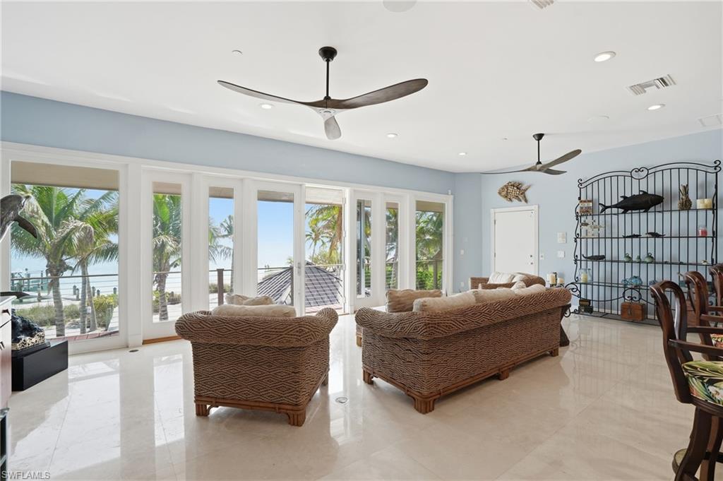 Living area featuring ceiling fan and recessed lighting