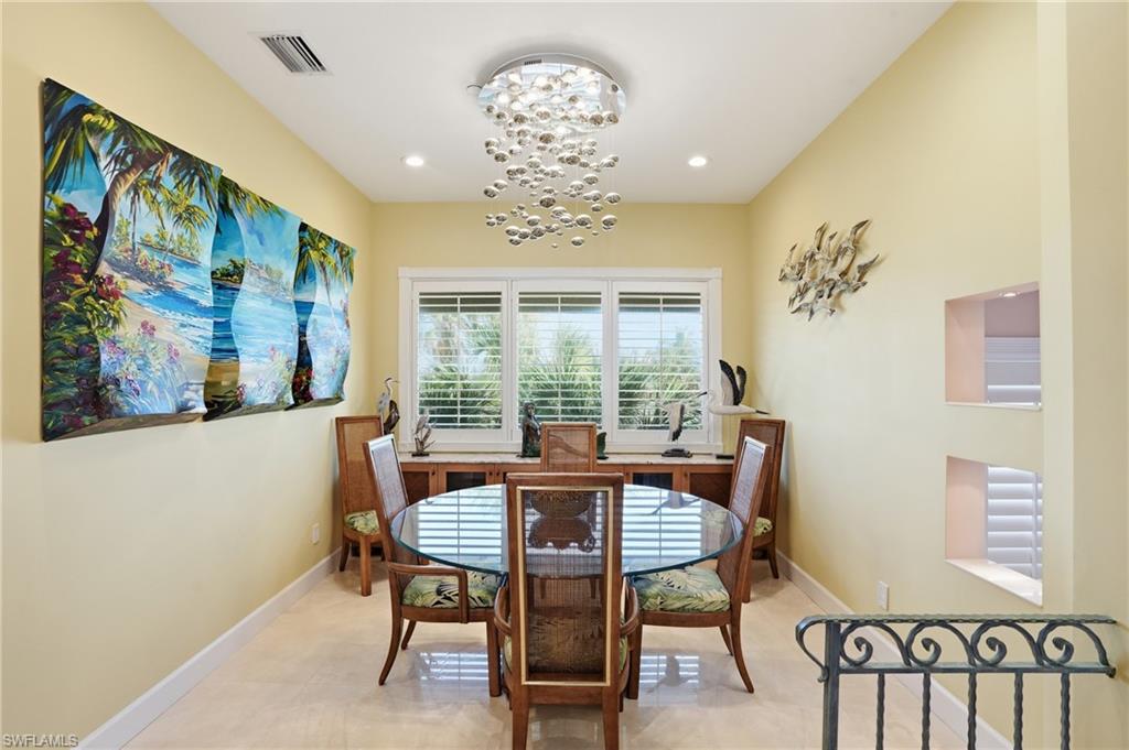 Dining area with suspended lighting and baseboards