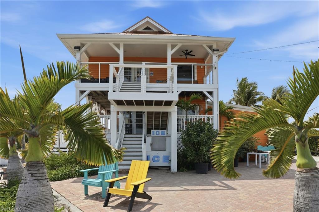 Back of house featuring a balcony and a patio area