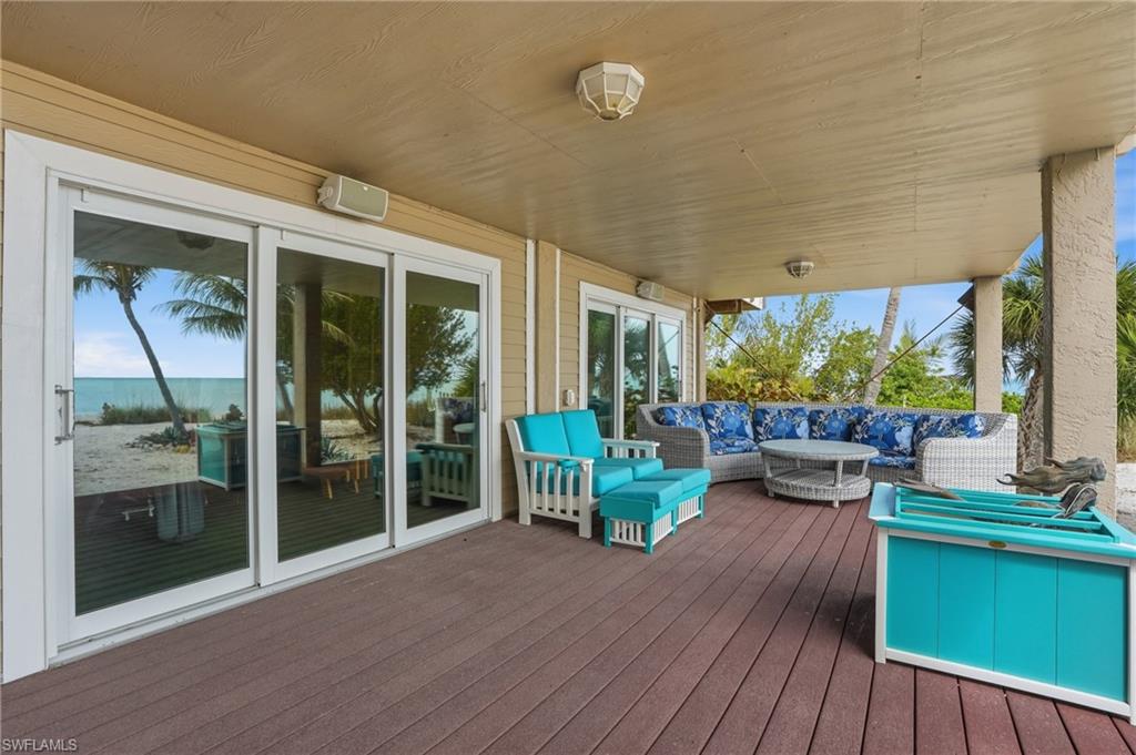Wooden terrace featuring outdoor furniture