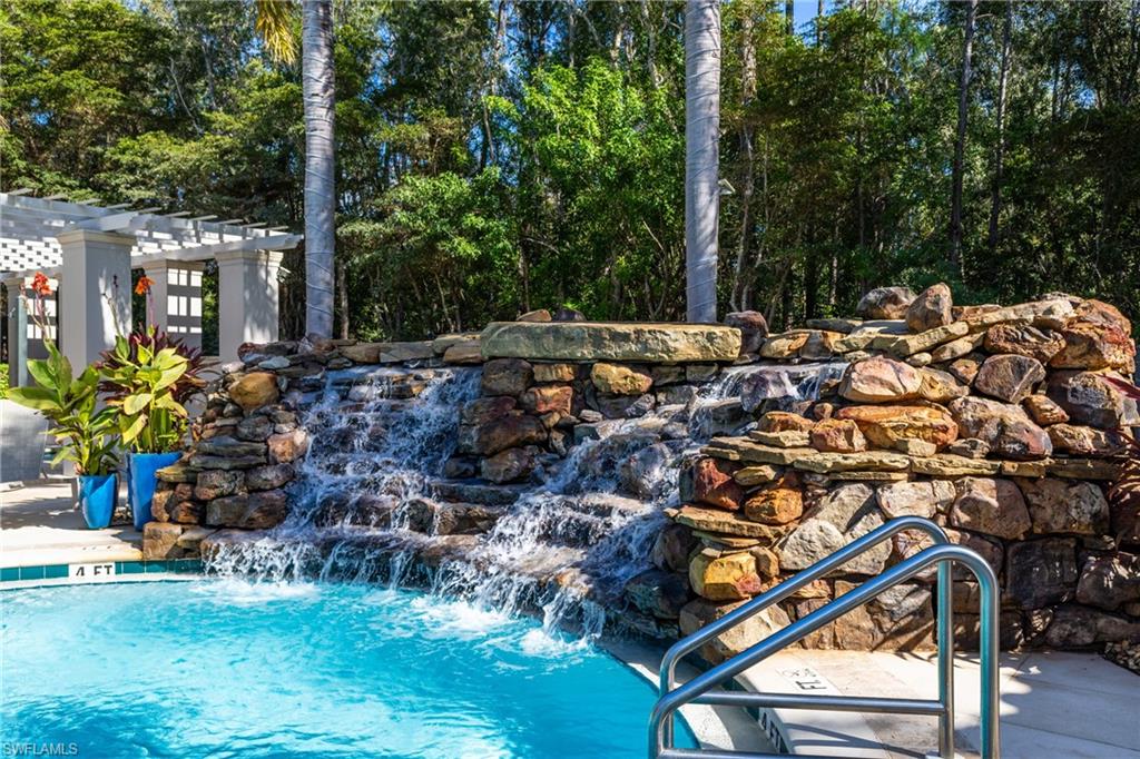 Outdoor pool featuring a pergola