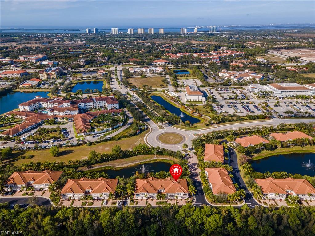 Aerial overview of property's location with a nearby body of water