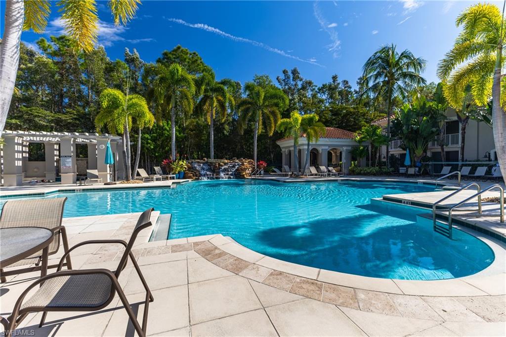 Community pool with a patio and a pergola