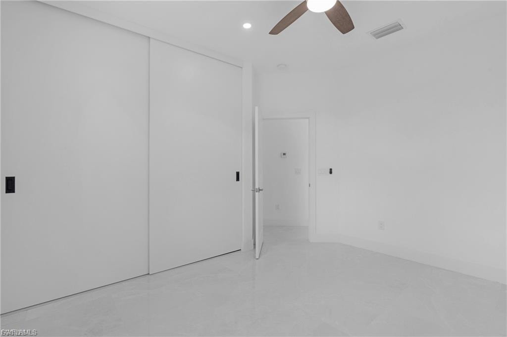 Unfurnished bedroom with a closet, a ceiling fan, and recessed lighting