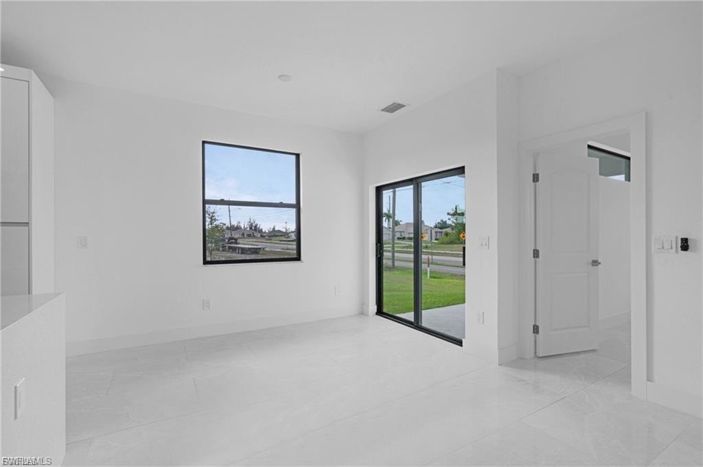Unfurnished room featuring baseboards