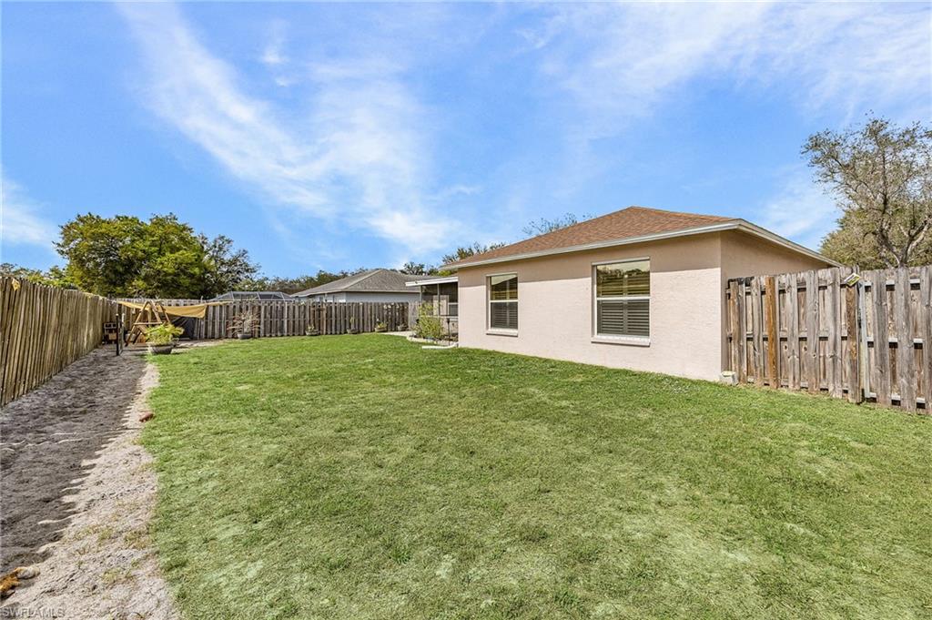 View of fenced backyard