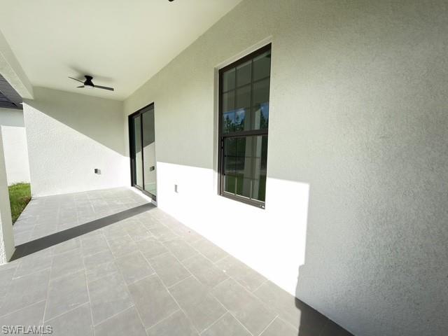 View of patio with a ceiling fan