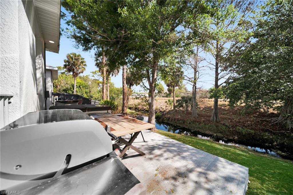 View of patio / terrace featuring a water view