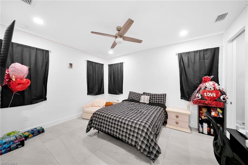 Bedroom featuring a ceiling fan and recessed lighting