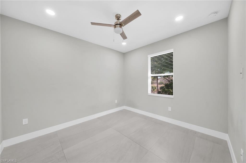 Empty room featuring recessed lighting and a ceiling fan