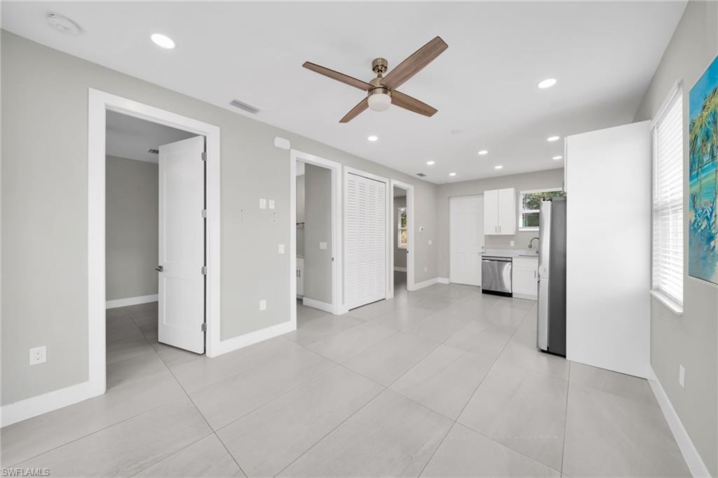 Unfurnished living room featuring ceiling fan, recessed lighting, and light tile patterned floors