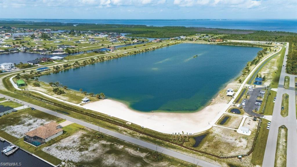 Aerial view of property's location featuring a large body of water