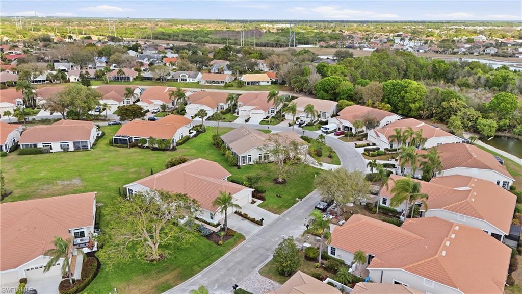 Aerial view of property's location featuring nearby suburban area