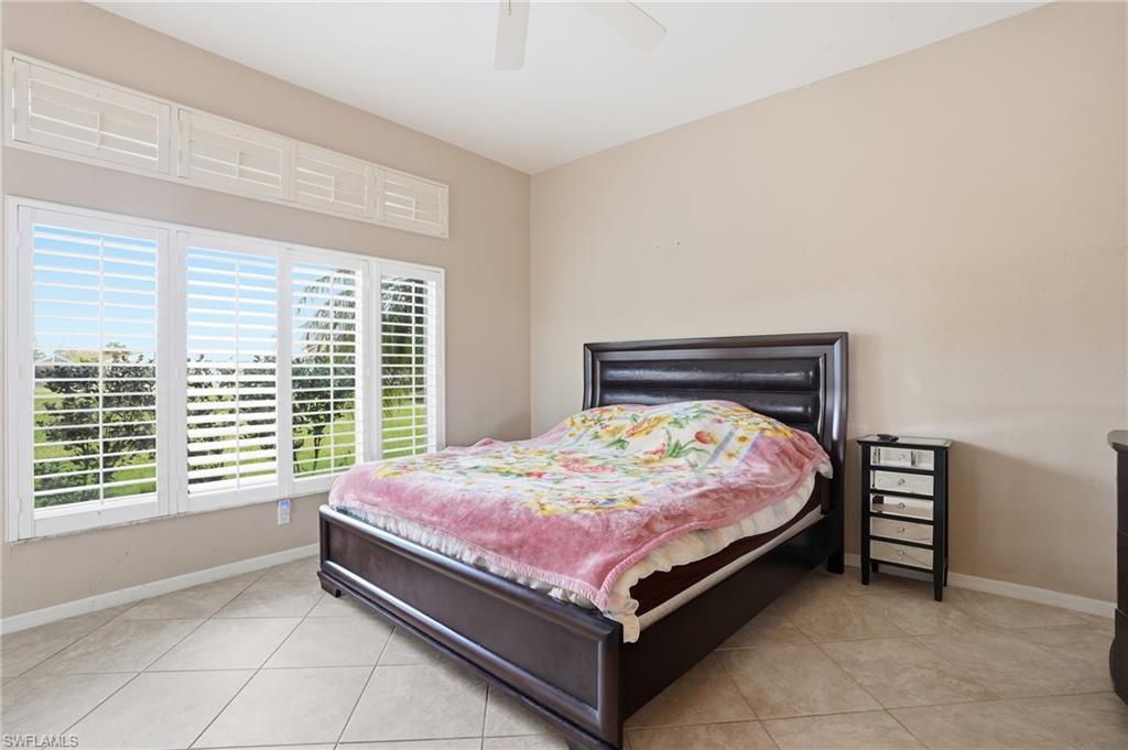 Bedroom featuring ceiling fan and light tile patterned floors